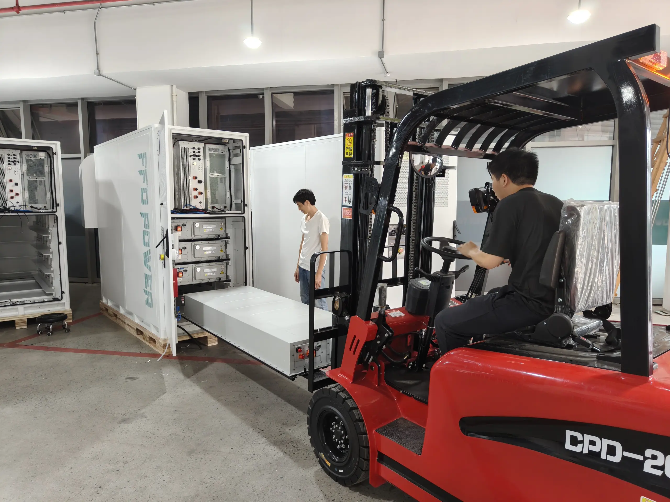 Assembly line producing Galaxy‑418 energy storage cabinets.