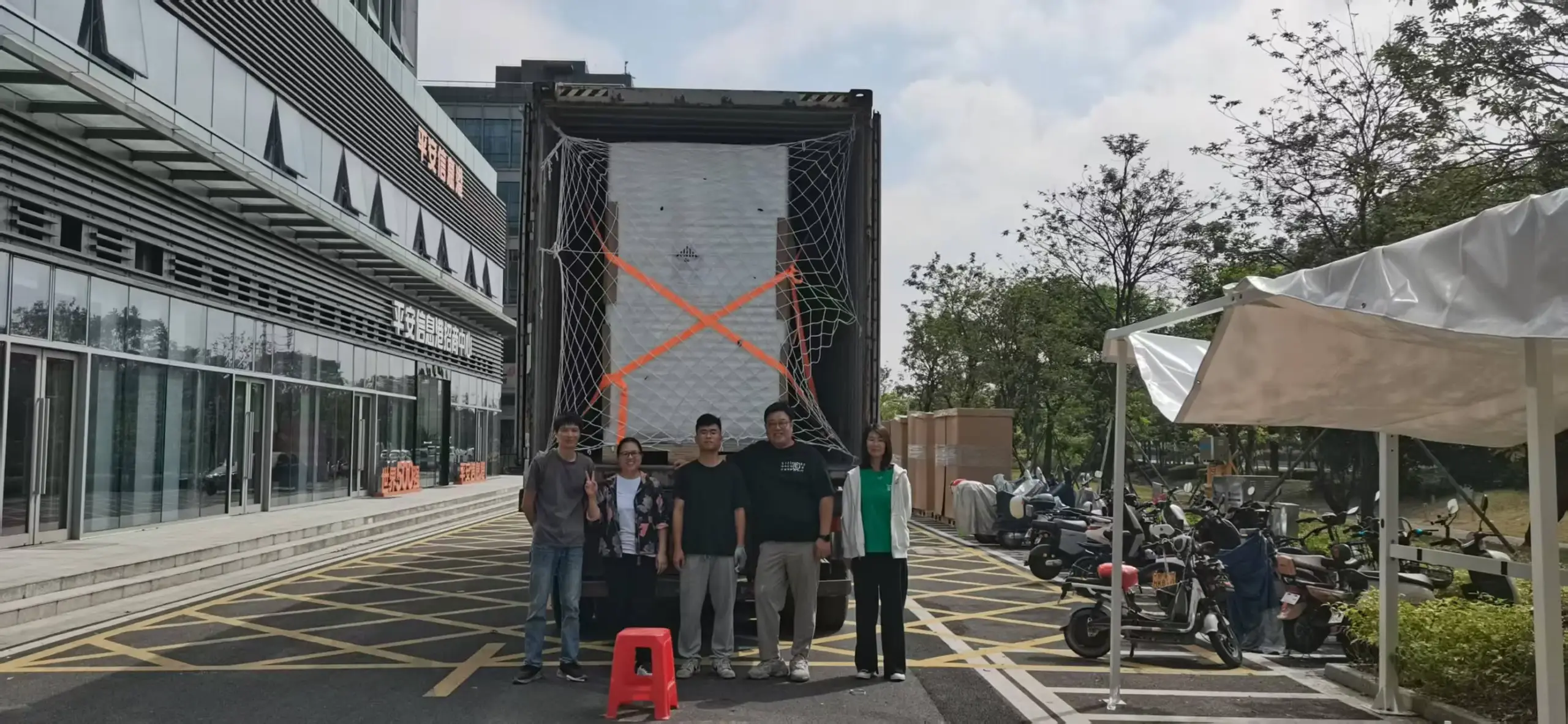 Containerized energy storage cabinets loaded for shipment.