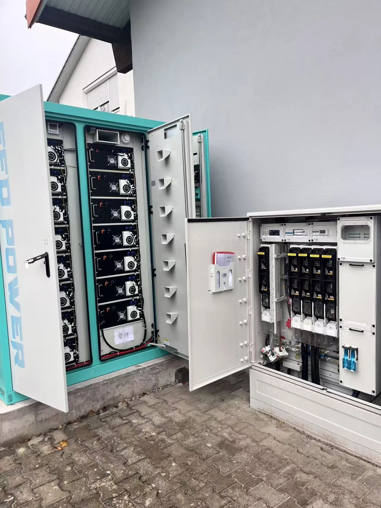 105kW/215kWh cabinet BESS installed for EV charging booster in Germany, showing battery racks and power distribution cabinet