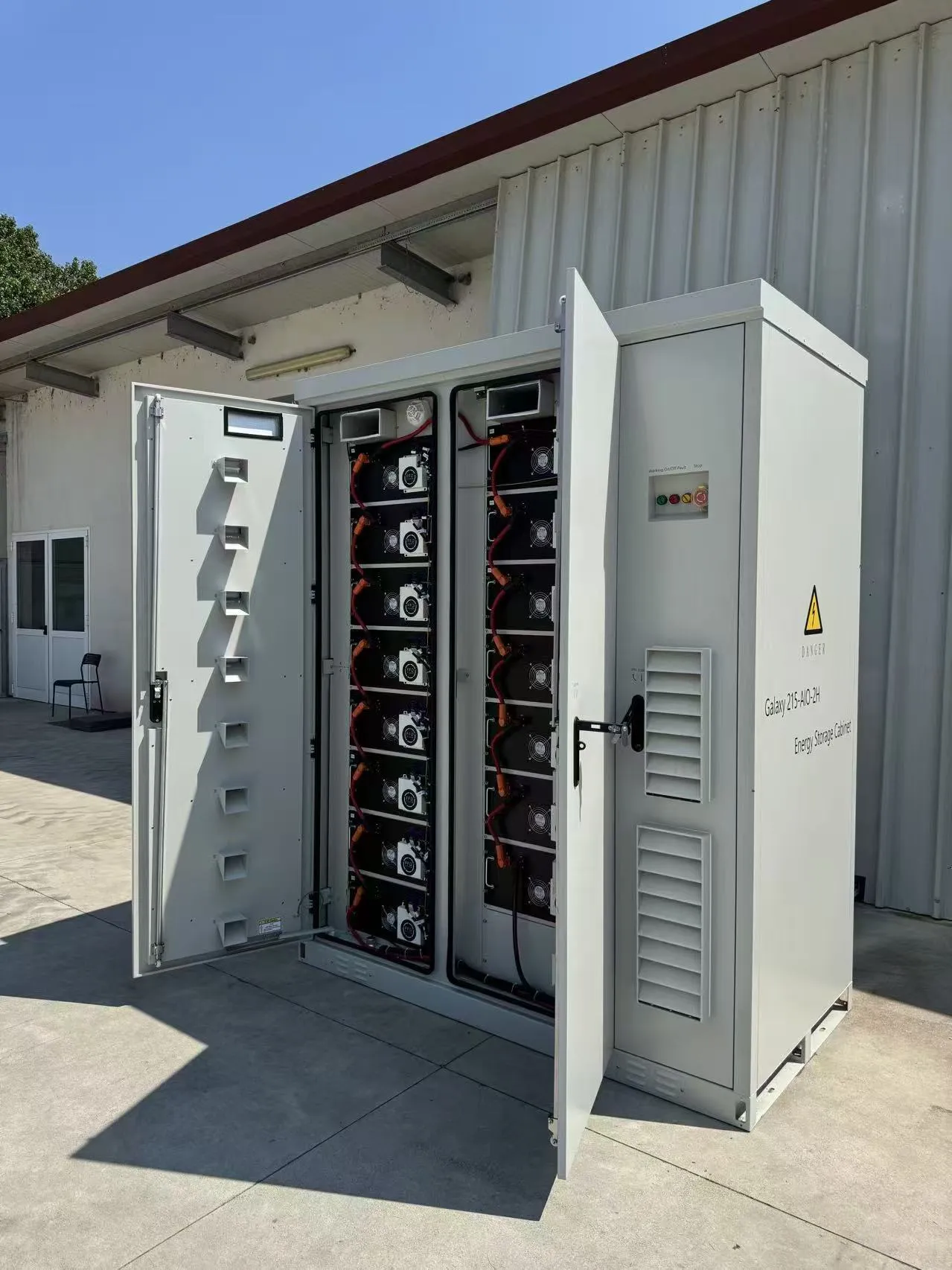 105kW/215kWh cabinet BESS for PV self-consumption in Italy, showing battery modules inside the open enclosure