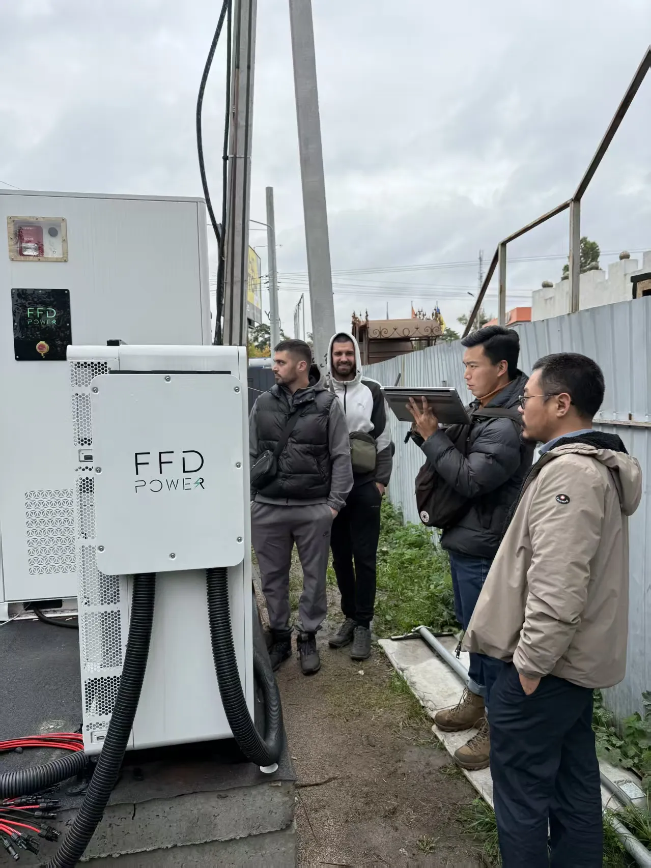 On-site commissioning of a 100kW/261kWh Galaxy 261L cabinet BESS for supermarket backup power in Ukraine (FFD POWER team at installation)